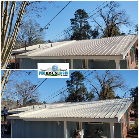 Professional pressure washing technician performing gentle roof wash